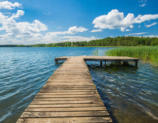 Wooden pier in the lake on a clear summer day