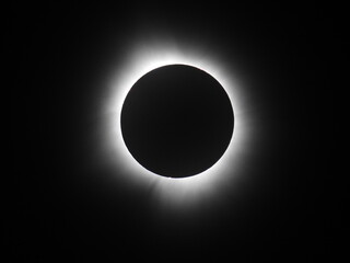 Solar Eclipse in Totality with Radiant Corona, Dark Moon Silhouette Against Sun