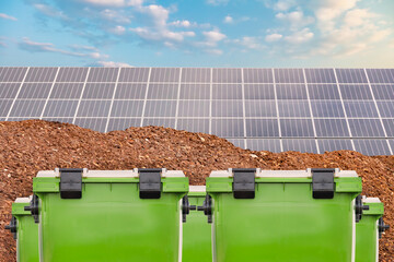 New green waste containers in front of biomass and a large solar panel farm - 780657073