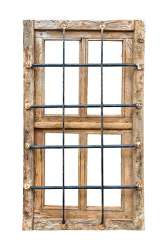 Ancient weathered prison window with rusted steel bars
