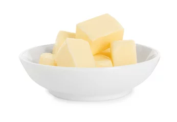 Fototapeten Tasty butter cubes in bowl isolated on white © New Africa
