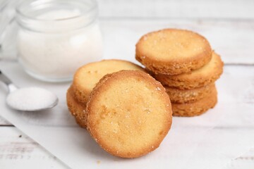 Tasty sweet sugar cookies on white wooden table, closeup