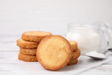 Fototapeta na wymiar Tasty sweet sugar cookies on white wooden table, closeup