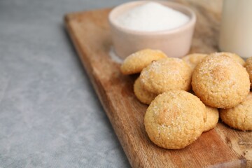 Tasty fresh sugar cookies on grey table, closeup. Space for text