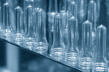 Close up scene of group of preform shape of PET bottle products.