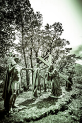 The Way of the Cross - The sanctuary of Our Lady of Lourdes - France 
Statues of Simon of Cyrene helping Jesus Christ carrying his cross, and the roman soldiers around them.