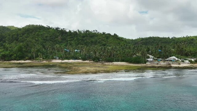 Freight ships and ferries in the bay, top view. Dapa Ferry Terminal. Siargao, Philippines