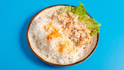 White rice and creamy chicken in bowl