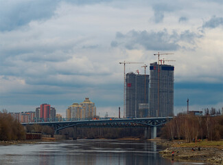 Building construction near the river bridge background - 780680026
