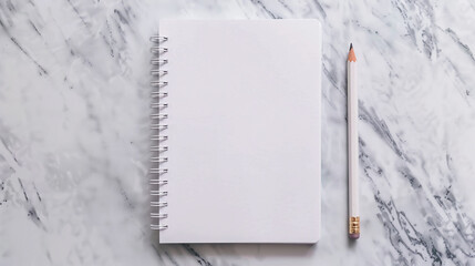 notebook with blank white page on light gray desk background