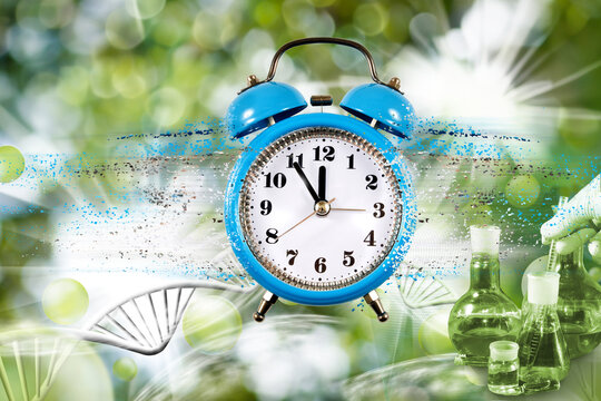 image of a clock with particles coming off it against a background of stylized DNA strands and chemical research tools