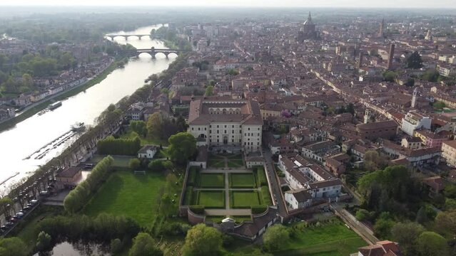 Flight over Borromeo gardens and college and Old Town in Pavia, Italy