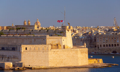 Old forts on the stone city wall above Valletta Bay. - 780692884