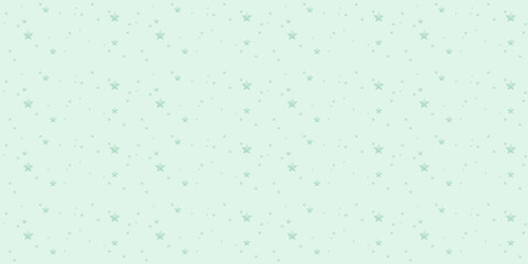 A lovely pattern of pale green stars of various sizes on a seamless pastel green background
