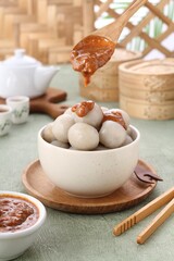 Cilok is a snack made from tapioca flour and served with savory and spicy peanut sauce