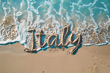 Italy written in the sand on a beach. Italian tourism and vacation background