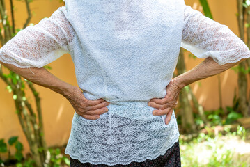 Senior woman have back ache, waist pain, lumbar muscle injury problem. Healthcare concept.