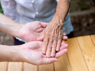 Helping hands, care for the senior people concept.
