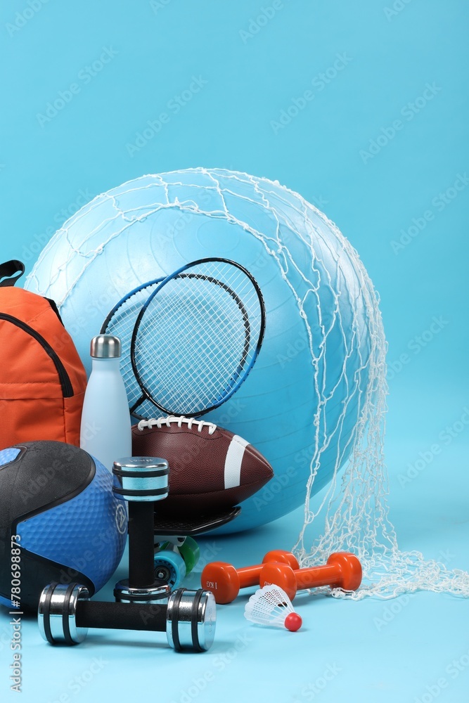 Poster Many different sports equipment on light blue background