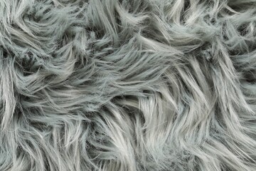 Texture of grey faux fur as background, closeup