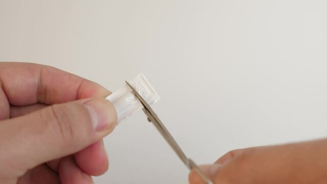 They cut the polyethylene package and take out the medicine in the form of a candle.