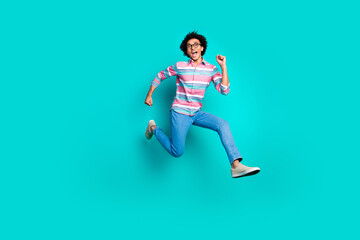 Fototapeta na wymiar Photo of funky glad crazy man wear stylish clothes running fast hurrying isolated on cyan color background