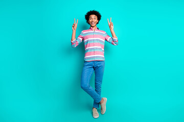 Photo of cheerful young man dressed stylish striped clothes v-sign isolated on cyan color background - obrazy, fototapety, plakaty