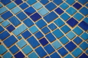 Close up of a frame placed blue mosaic tiles on it