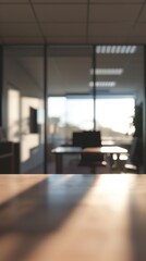 A blurry conference room in an office building with a table, chairs, glass windows and a ceiling that gives a view of the sky and the city outside