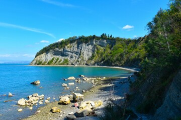 View of the Moon bay with a flysch cliff in Strunjan nature reserve in Littoral region, Slovenia - obrazy, fototapety, plakaty