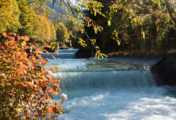 Rissbachstollen, affluent stream of lake Walchensee, with cascades, in autumn - 780724894