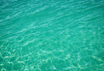 Fototapeta na wymiar Blurred turquoise blue green water backdrop