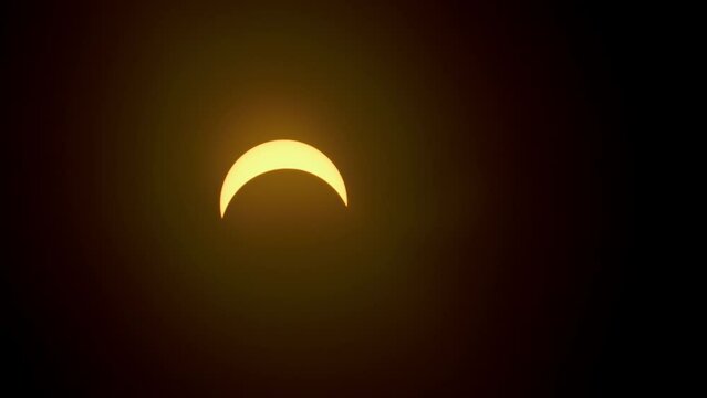 Partial solar eclipse by moon time lapse closeup