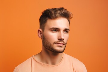 Obraz premium A man with a beard and a mustache is wearing a pink shirt