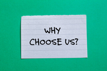 Why choose us ? words written on torn paper piece with green background. Conceptual business symbol. Copy space.