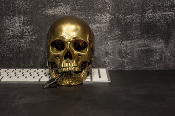 A still life with a golden skull eager to eat computing