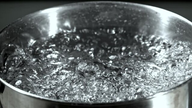 Super slow motion saucepan with boiling water. High quality FullHD footage