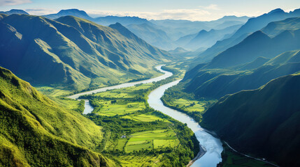 areal view of landscape with river and mountains.