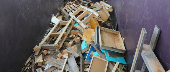 Inside a recycling center container with wooden pieces and scrap lumber