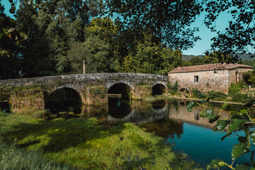 Small mill located next to the river in the region of Minho, Portugal. - 780755423