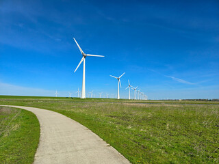Fototapeta na wymiar Windmill park in the ocean, drone aerial view of windmill turbines at sea in the Netherlands