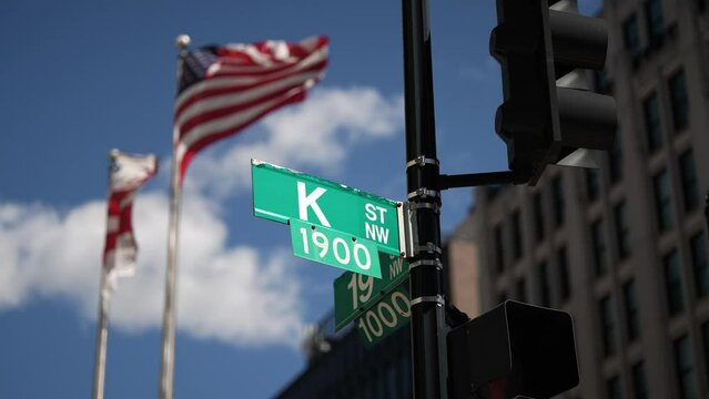 K street nw and 20th street nw street signs in downtown Washington DC symbolizing lobbying and corruption in nations capital