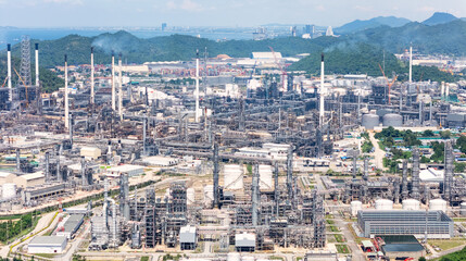 Aerial view of Oil and gas industry - refinery, Shot from drone of Oil refinery and Petrochemical plant with transportation port