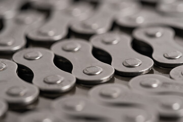 Closeup of a bicycle chain. Selective focus. Shallow depth of field.
