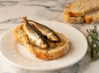 Bread toast with sardines. Tasty Mediterranean snack.