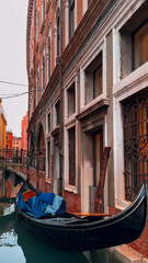 Medieval houses, narrow canals, bridges and gondolas in Venice, Italy, February 10, 2024. - 780804407