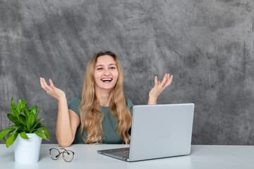 Blonde-haired girl in gray dress displaying various poses near laptop and green flower