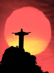 Sunset silhouette of the Christ the Redeemer monument, Wonder of the Modern World, on Corcovado...