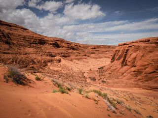 Red desert landscape near Page Arizona with mesas and bluffs and red sandstone canyon walls