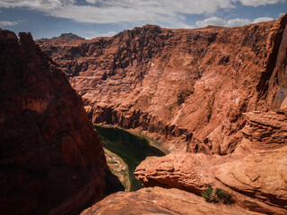 Fototapeta na wymiar Wide view looking down on Colorado River in Glen Canyon in red sandstone canyon in Page Arizona
